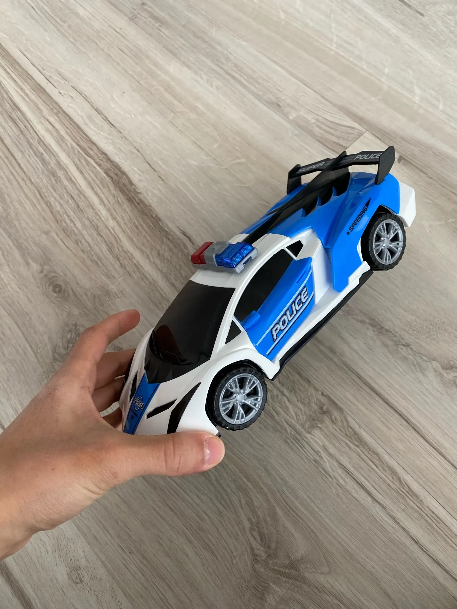 360 Rotating Light Up Police Car Toy photo review